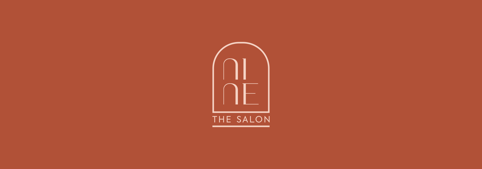 Nine The Salon logo — arched monogram on terracotta